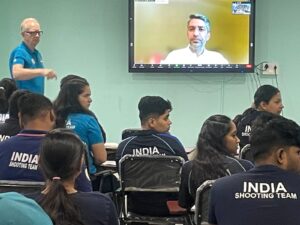 Q&A session of Abhinav Bindra (on screen), with the Indian national shooting squad (foreground) at the Dr. Karni Singh Shooting range