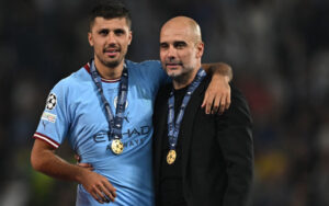 Rodri with Pep Guardiola