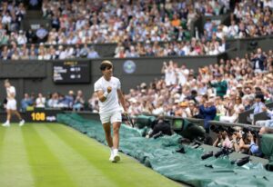 Carlos Alcaraz in action in Wimbledon 2024