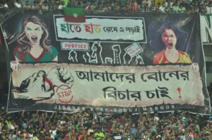 Fans with the protest tifo after the final whistle