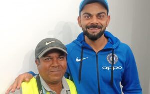 Debasis Sen with Virat Kohli