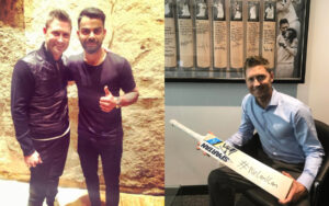 Michael Clarke with Virat Kohli and his signed bat