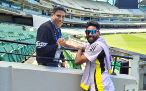 Boria Majumdar with Mohammed Siraj at the MCG