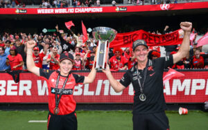 Melbourne Renegades skipper and coach with the WBBL 10 Trophy and fans 