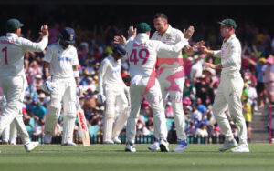 Scott Boland celebrates with his teammates at the SCG