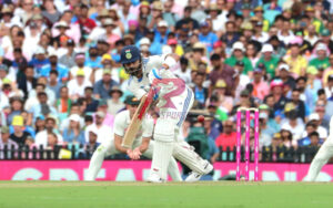 Virat Kohli nudges a ball towards the leg side at the SCG