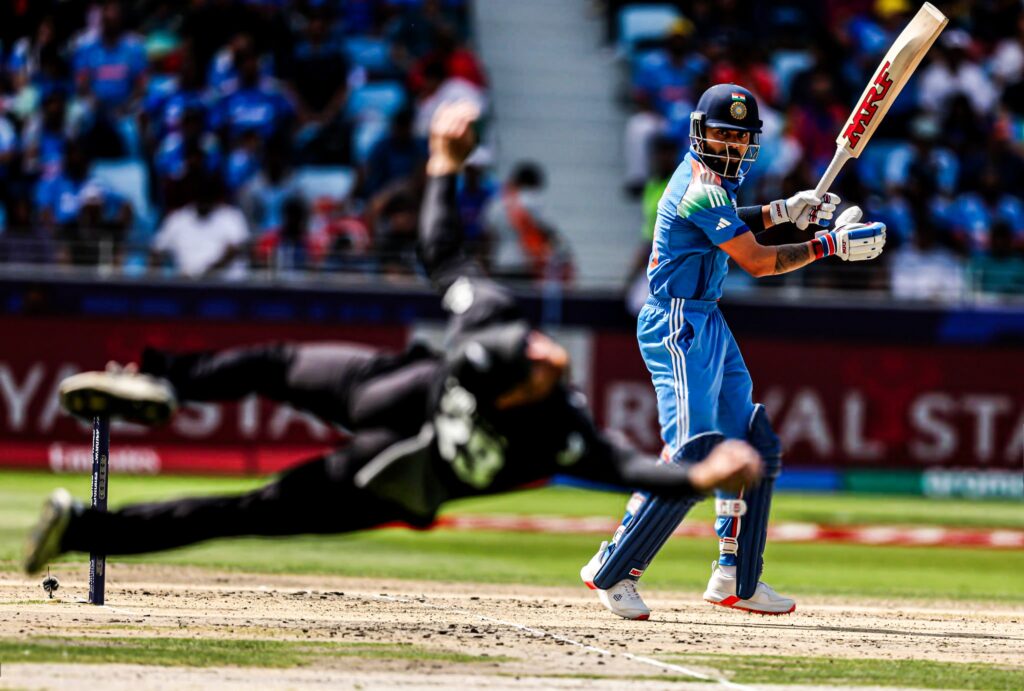 Glenn Phillips takes a blinder as Virat Kohli looks on