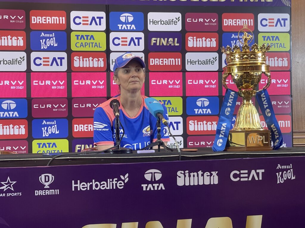 MI coach Charlotte Edwards with the WPL trophy at the post-match presser