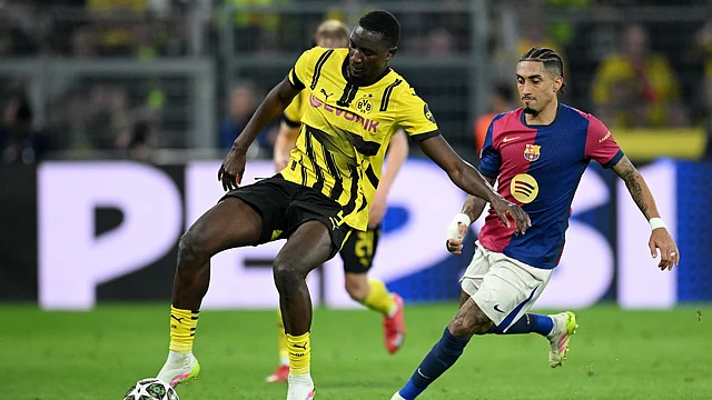 Serhou Guirassy hat-trick as Dortmund win 3-1, but nervous Barcelona prevail 5-3 on aggregate