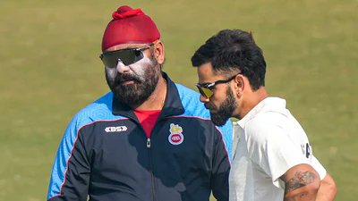 Virat Kohli with Sarandeep Singh