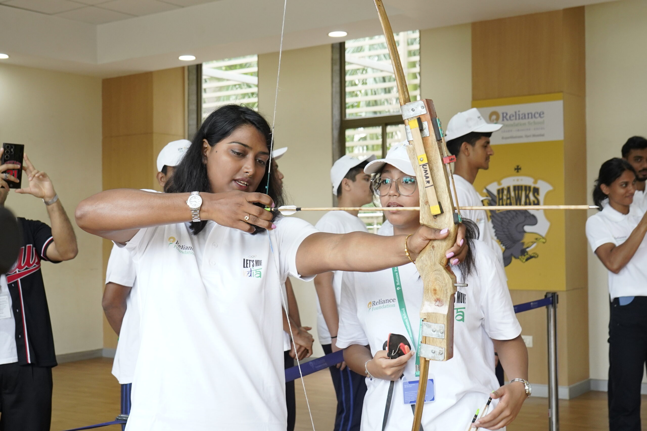 Reliance Foundation supported athlete Deepika Kumari teaches a young student her craft as part of Reliance Foundation's Olympic Day celebration with Let's Move India in Navi Mumbai today