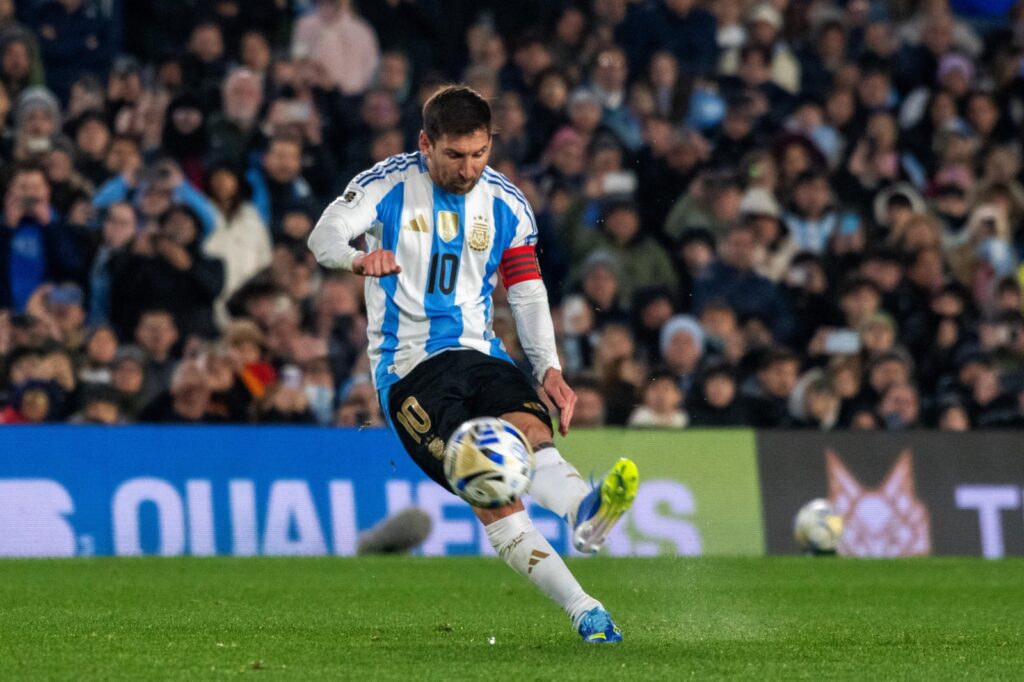 Lionel Messi leaves the ground in tears after Argentina’s 3-0 win over Venezuela